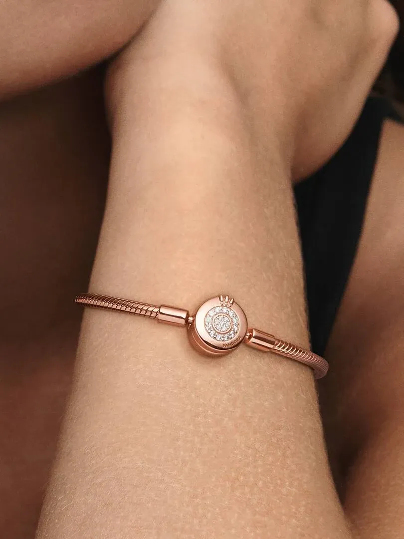 Close-up of the bracelet on a wrist, side view with blurred background.