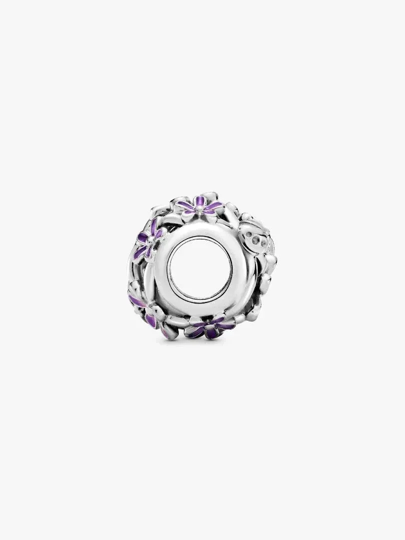 Silver charm with purple floral details, front angled view on a white background.