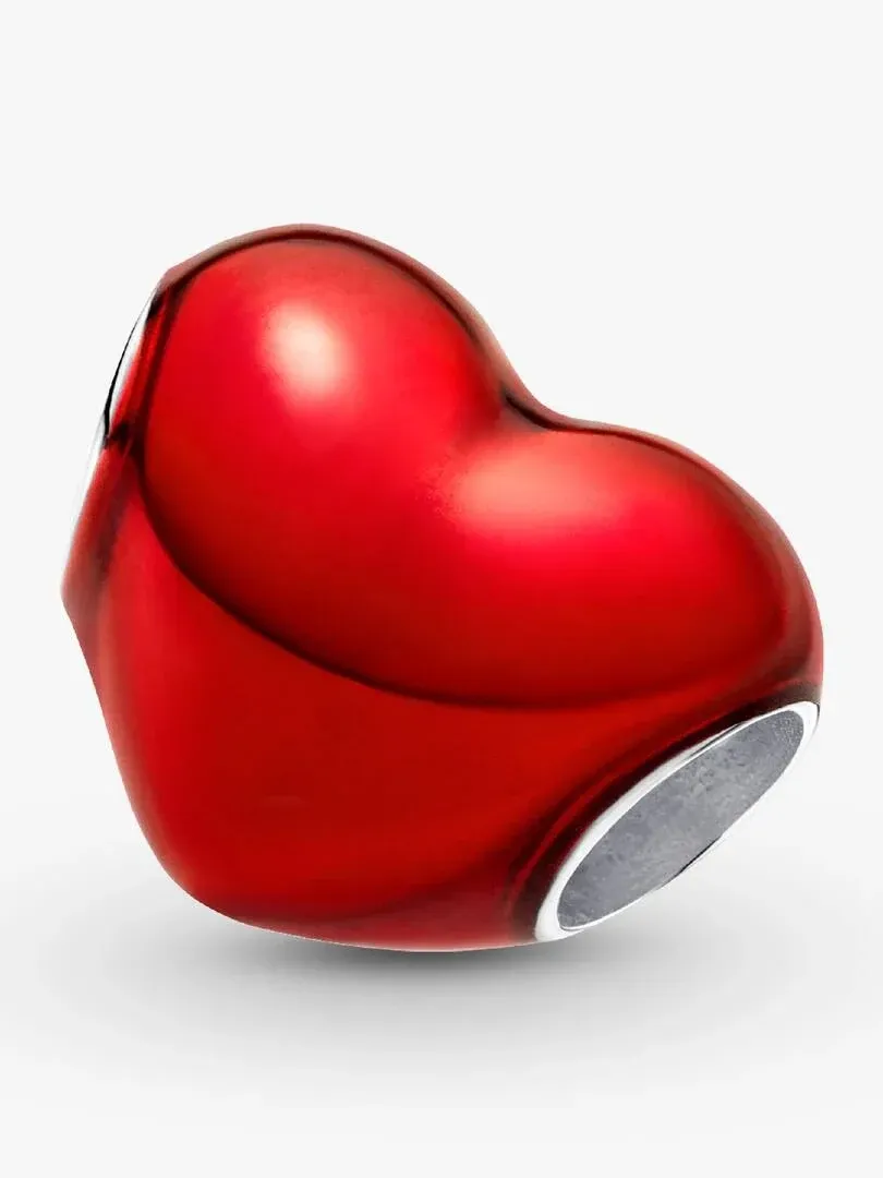 Red heart charm shown from a side angle, white background, highlighting the translucent enamel and silver base.