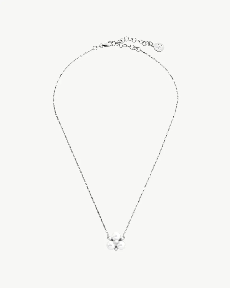 Silver necklace with three white pearls on a white background, full frontal view.