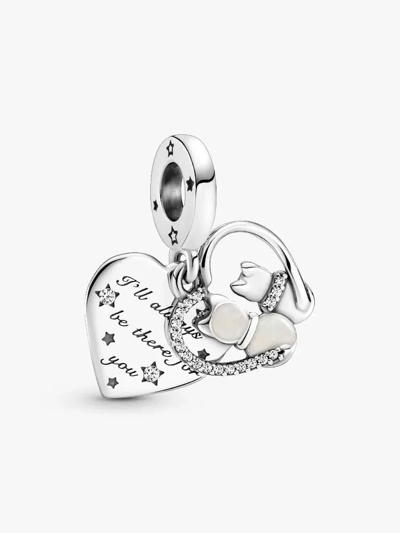 Front view of the silver charm with engraving and cubic zirconia, white background, slight high-angle shot.
