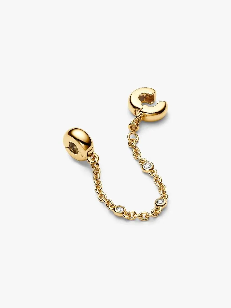 Chaîne de sécurité avec trois zircons sur fond blanc, vue en angle diagonal.