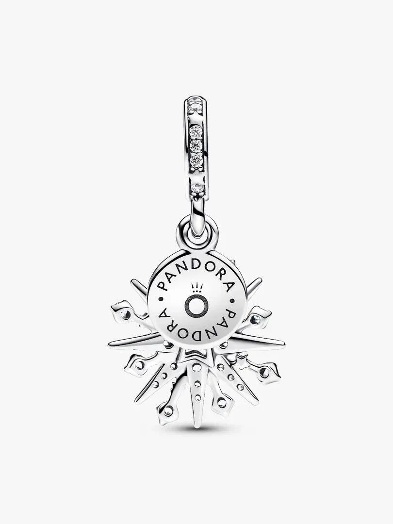 Front view of double charm on white background, showing engraved details and radiant starburst points.