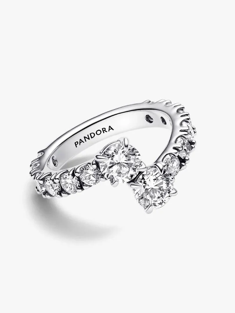 Silver ring with cubic zirconia shown at a side angle, white background, detail of the brand engraving.