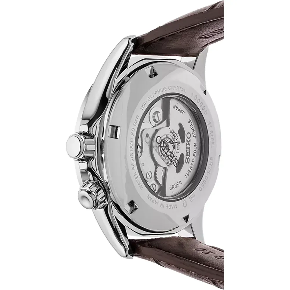 Vista posterior del reloj, tapa trasera transparente con maquinaria visible sobre fondo blanco