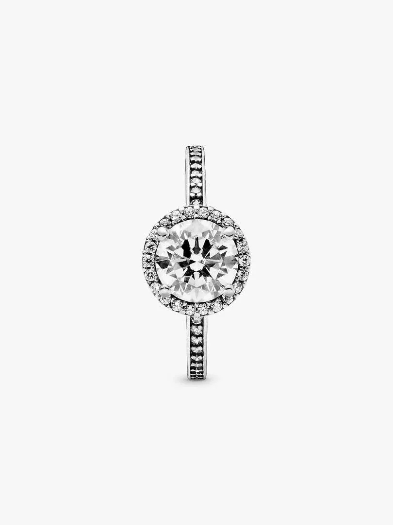 Silver ring with central cubic zirconia and halo, front view on white background.
