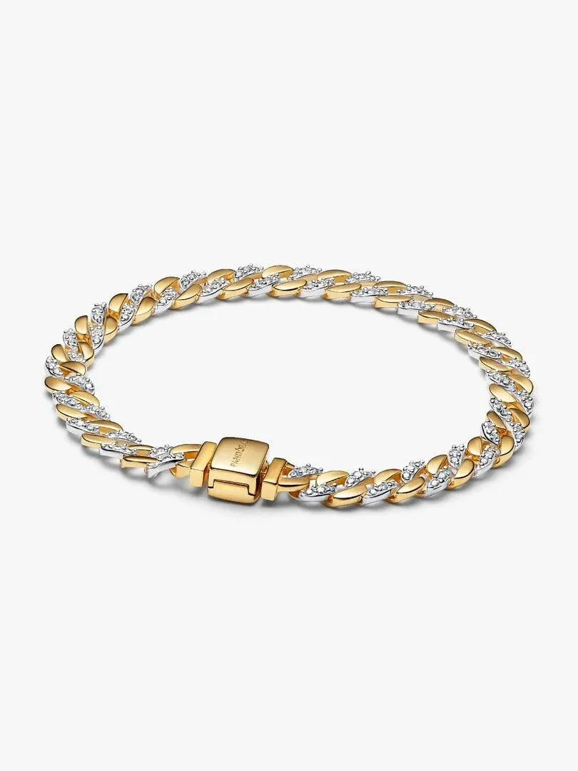 Top view of the Cuban link bracelet on a white background, showing the clasp and two-tone metal contrast.
