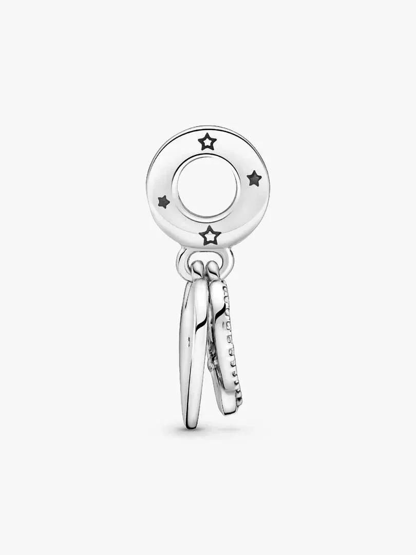 Silver charm shown in profile view, featuring engraved stars and cubic zirconia on a white background.