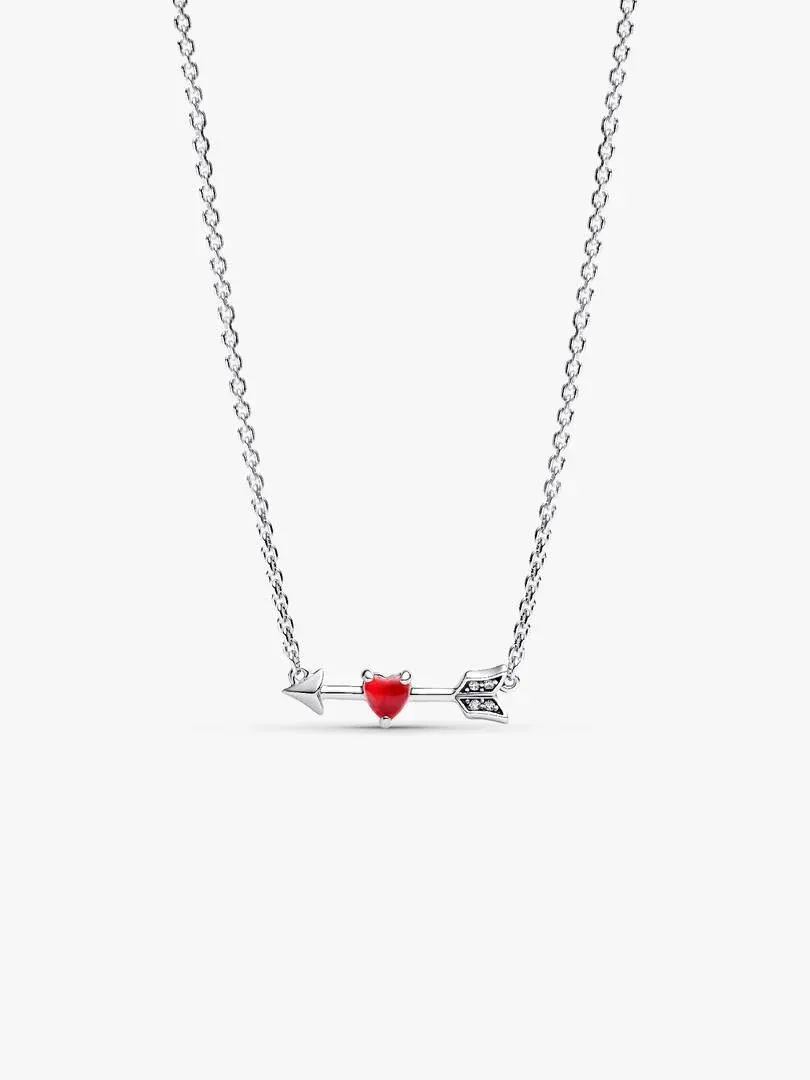 Silver necklace with arrow and red heart pendant, front view on white background.
