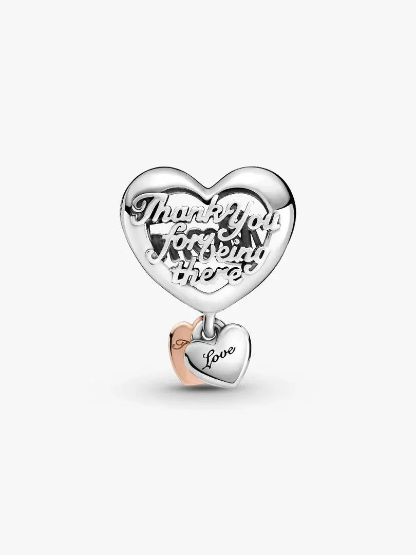 Silver heart charm with cutout inscription, front view on a white background.
