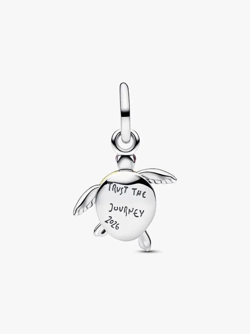 Front view of turtle charm featuring 'TRUST THE JOURNEY 2026' engraving, white background.