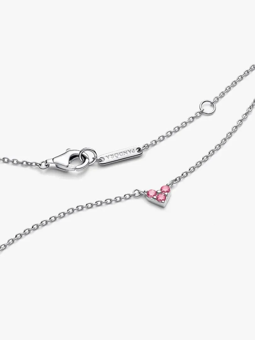 Close-up of the pink heart pendant and chain clasp on a white background.