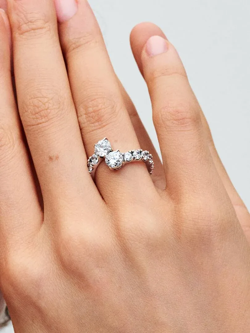 Side close-up of the cubic zirconia ring worn on a finger, shot on model skin.