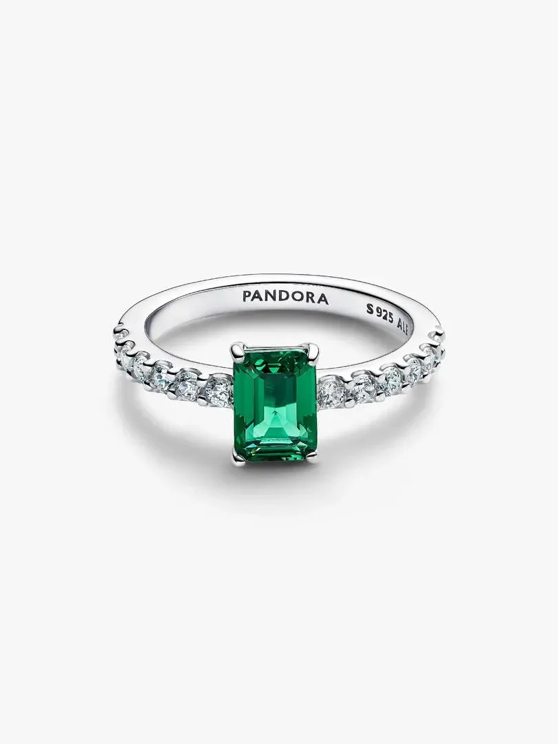 Silver ring with rectangular green stone and pavé setting, front angle view on white background.