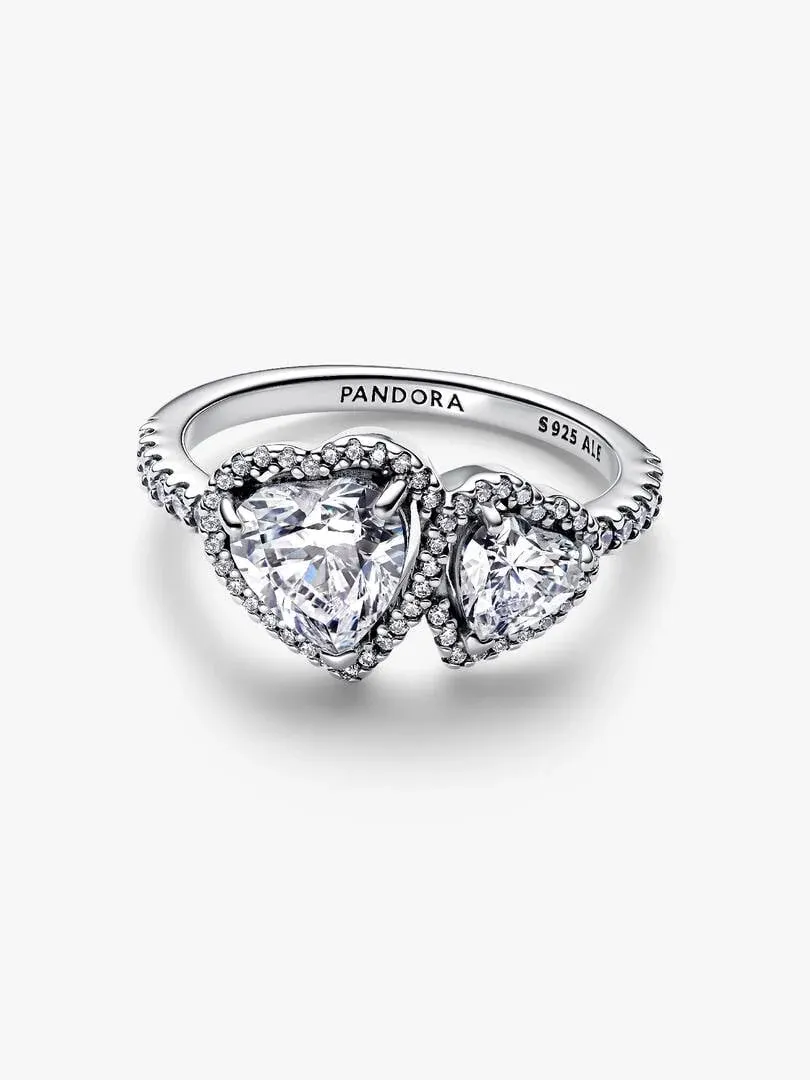 Side view of the double heart ring on a white background, showing pavé setting and silver hallmarks.