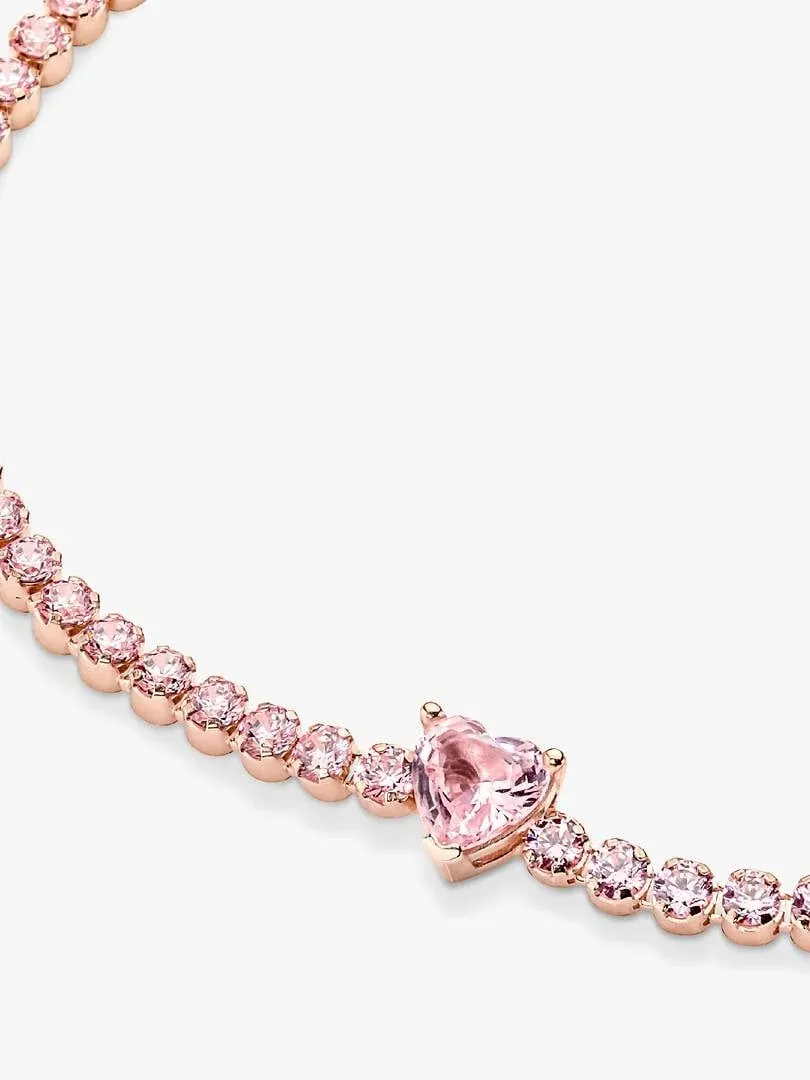 Close-up of the bracelet featuring a heart-shaped center stone, diagonal view on a white background.