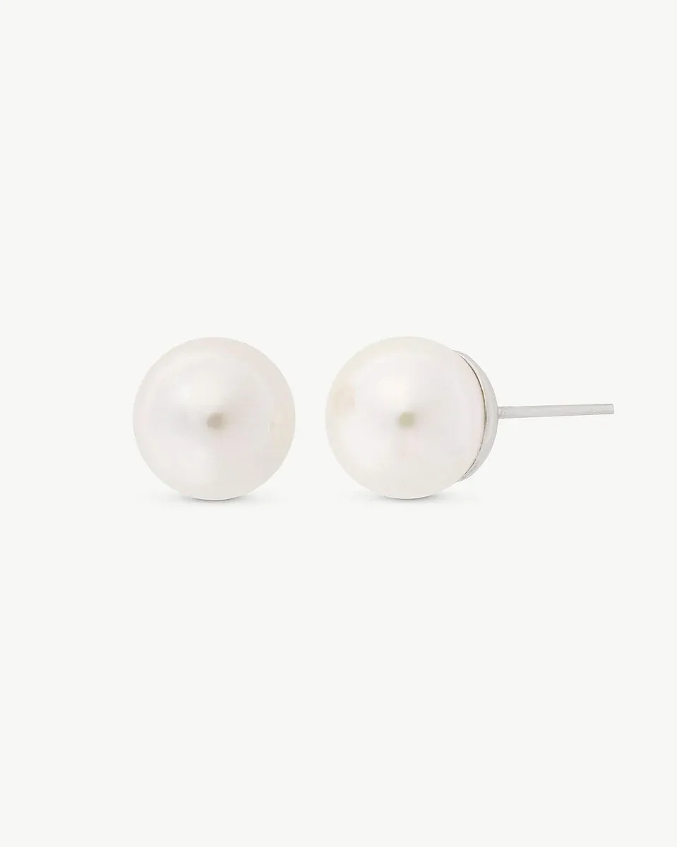 Front view of white pearl stud earrings on a white background, showing the side post.