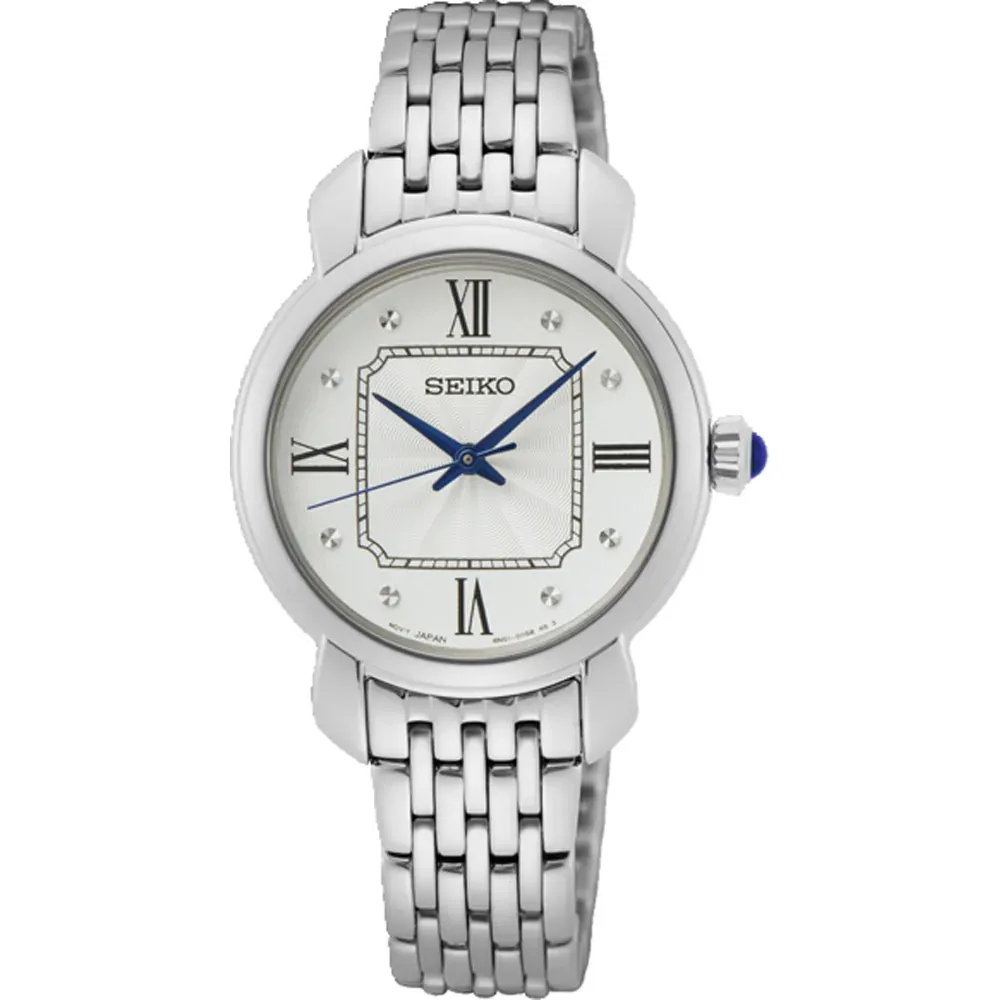 Vista frontal del reloj sobre fondo blanco, centrado, con brazalete de eslabones y esfera blanca.