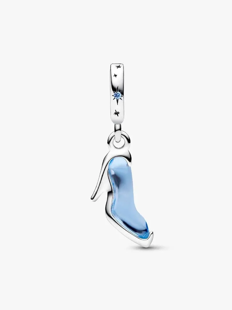 Side view of shoe charm on white background, featuring blue crystal and star-engraved bail.