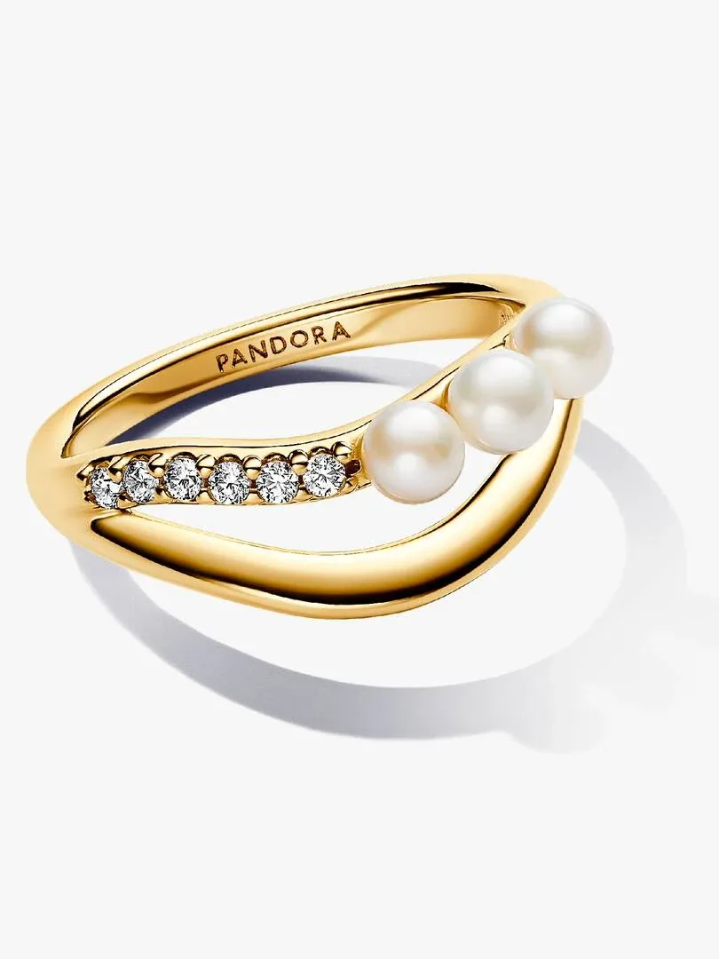 Double band ring with pearls and cubic zirconia, angled side view on a white background.