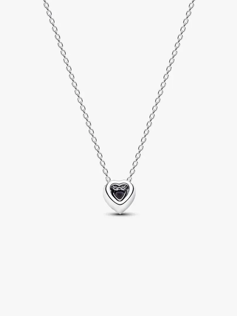 Front view of heart pendant necklace with fine chain on a pure white background.