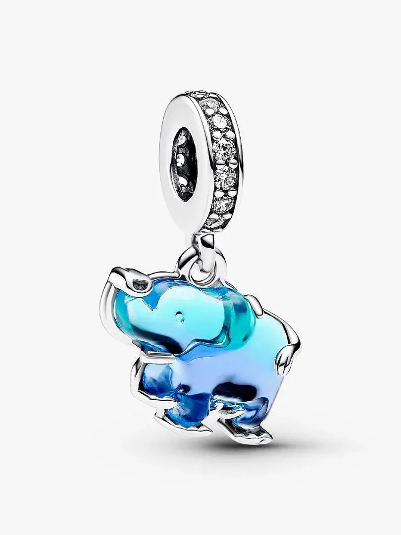 Blue Murano glass elephant charm with silver pavé ring, side view on white background.