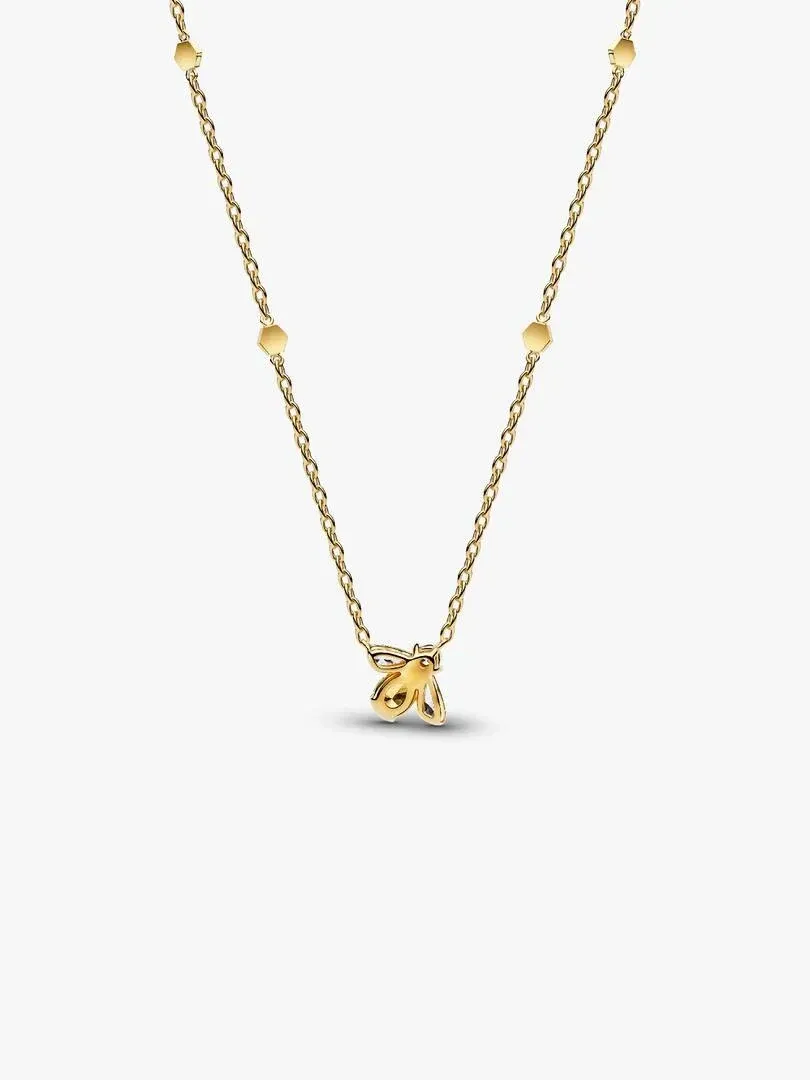Bee pendant necklace shown from a front angle, gold chain with hexagonal links on a white background.