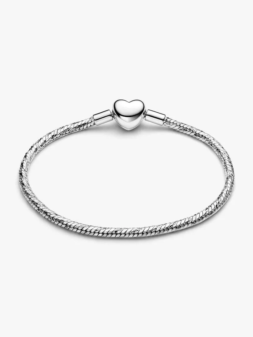 Top view of the snake chain bracelet closed with a heart clasp, on a white background.