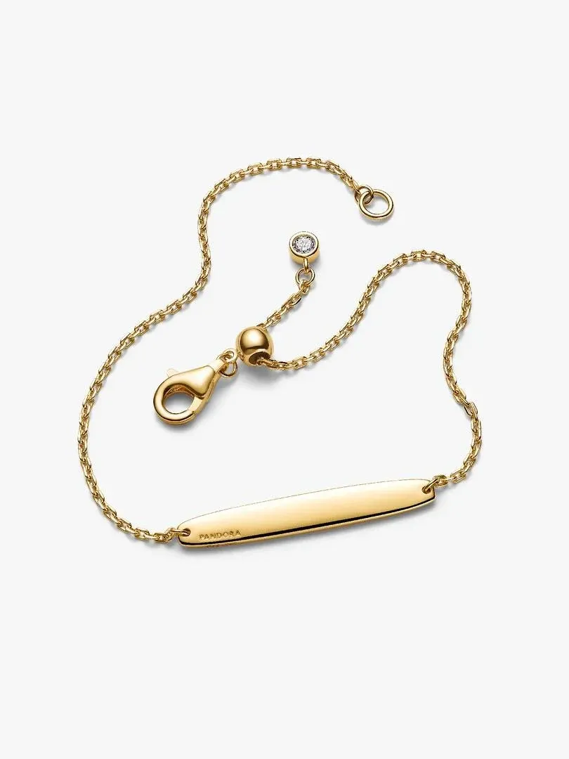 Bracelet chaîne avec barre centrale et détail en zircon, vue de face sur fond blanc.