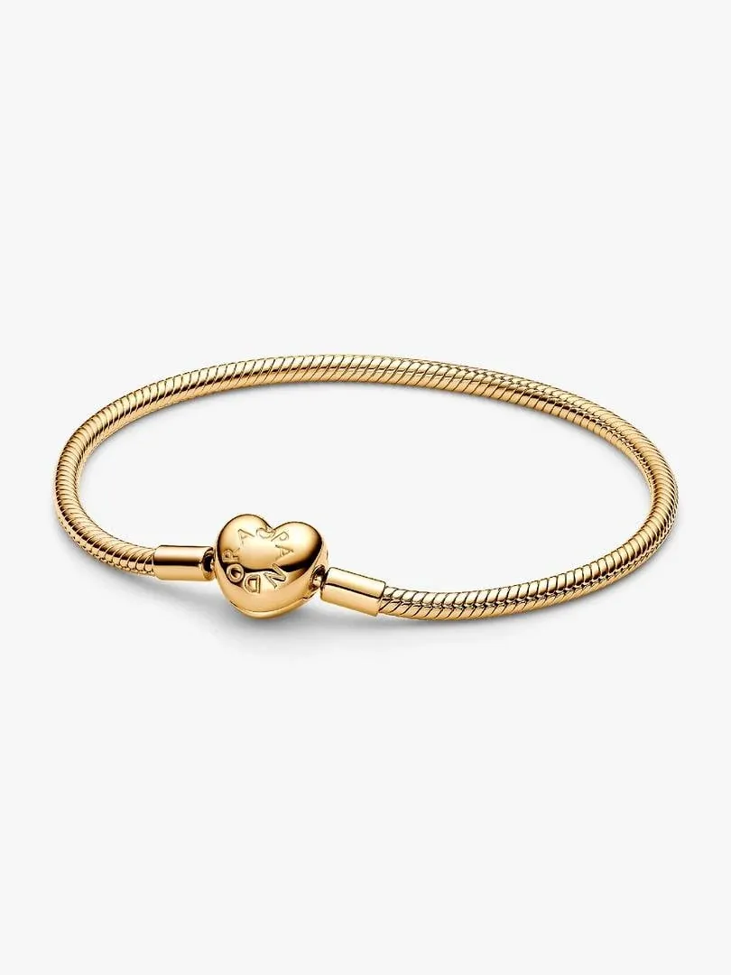 Gold-tone snake chain bracelet with heart clasp, front view on a white background.