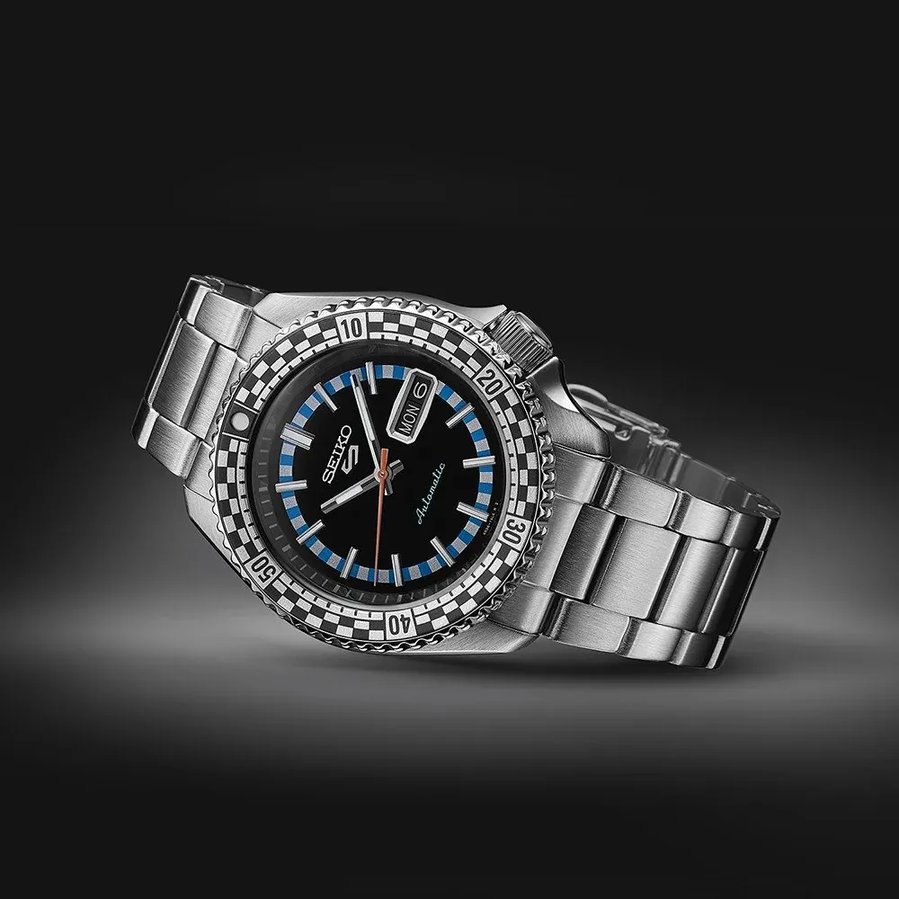Three-quarter angle view of the watch on a black background with focused lighting.