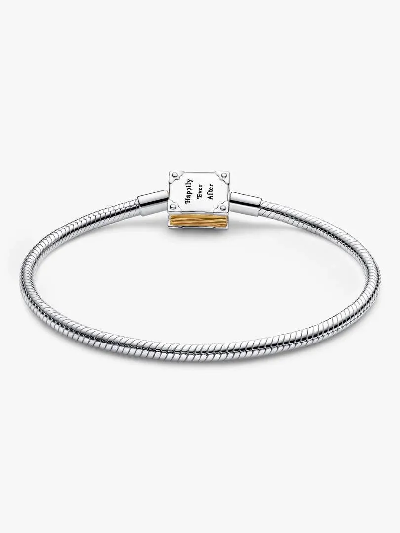 Front view of the bracelet on a white background, highlighting the book clasp engraving and gold details.