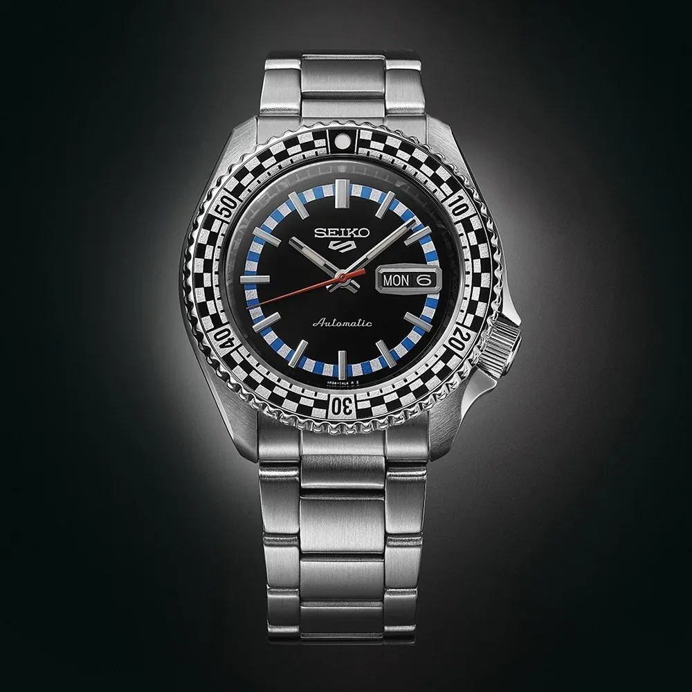 Front view of the watch centered on a dark gradient background.