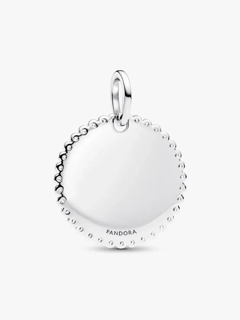 Front view of round pendant with cubic zirconia halo, white background, slight high-angle shot.
