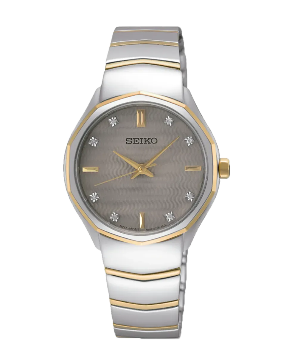 Vista frontal completa del reloj sobre fondo blanco, brazalete y caja en acero bicolor plata y oro.