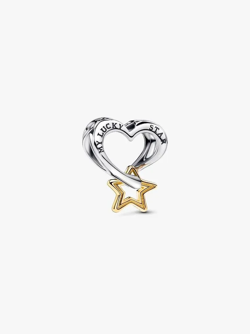 Close-up of the star and heart charm with engraving, on a white background.