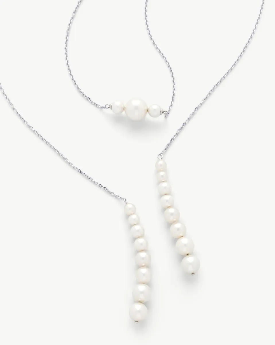 Pearl necklace on white background, front view showing graduated pearls on a silver chain.