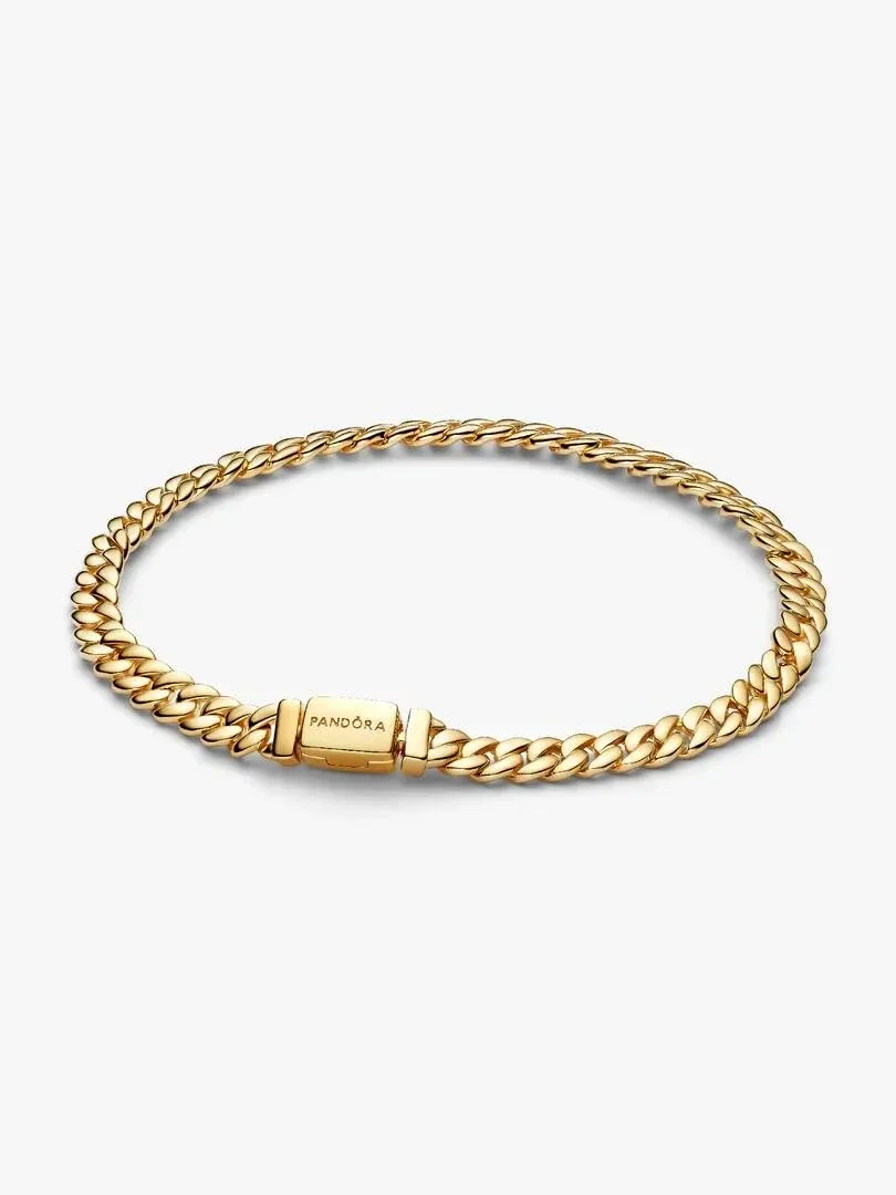 Top view of Cuban link bracelet on white background, focusing on the flat engraved clasp.