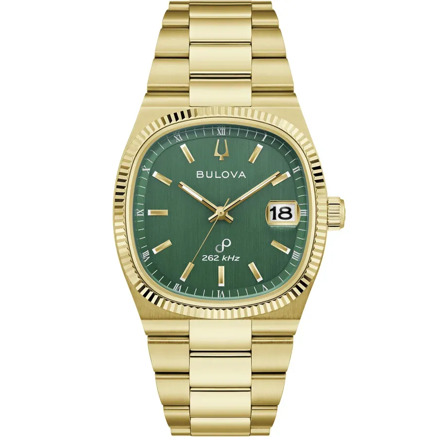 Vista frontal completa del reloj con caja y brazalete chapado en oro, esfera verde, sobre fondo blanco.