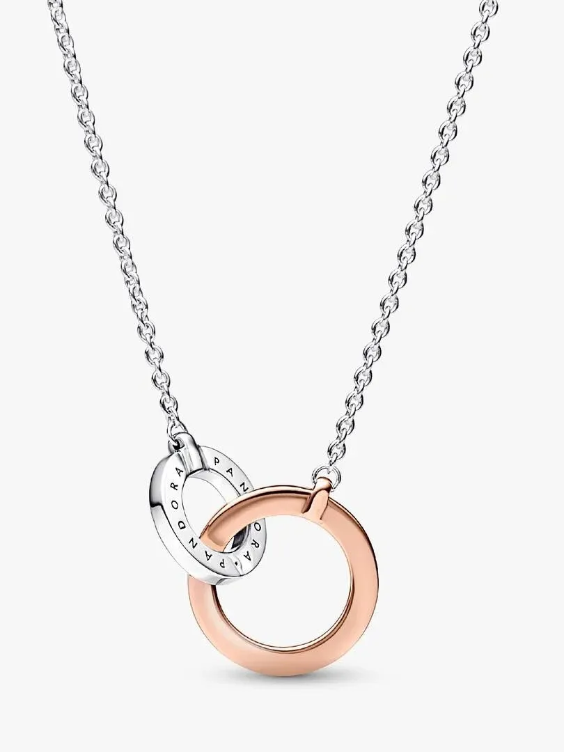 Two-tone interlocking circle necklace in silver and rose gold on a white background, front view with chain extended.