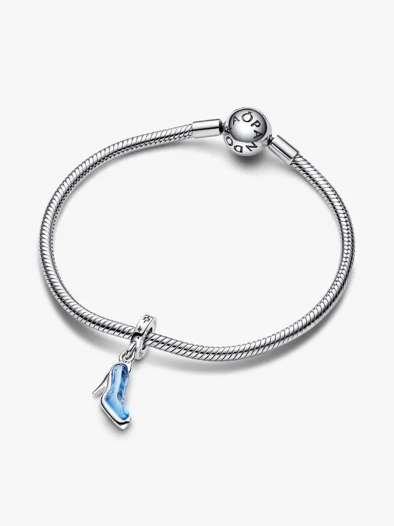 Blue slipper charm hanging from a silver bracelet, front view on a white background.