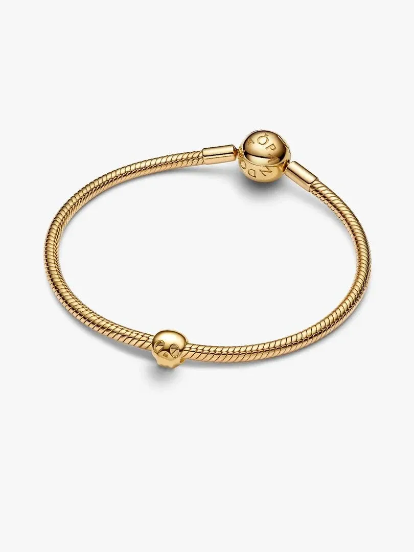Gold link bracelet shown at a diagonal angle on a white background, featuring the spherical clasp.