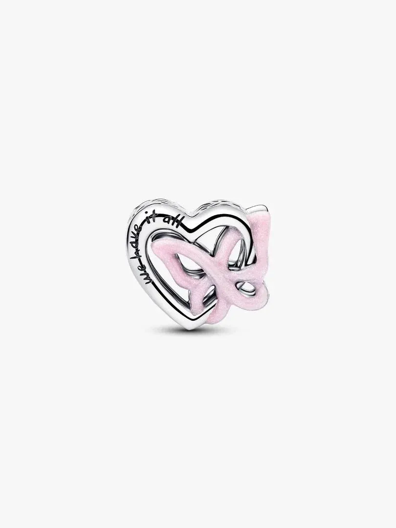 Side view of the heart and pink butterfly charm on a plain white background.