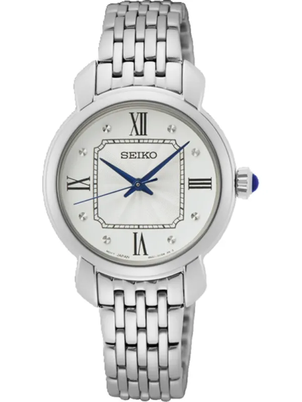 Vista frontal del reloj sobre fondo blanco, centrado, con brazalete de eslabones y esfera blanca.
