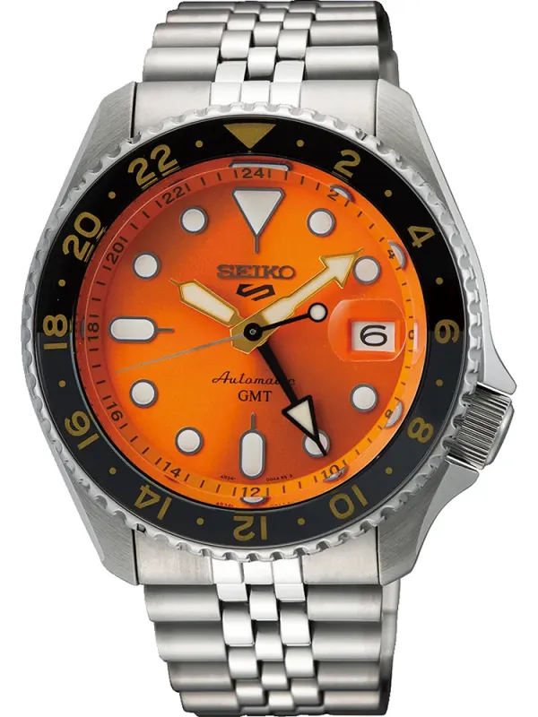 Vista frontal del reloj con esfera naranja y brazalete de acero inoxidable sobre fondo blanco