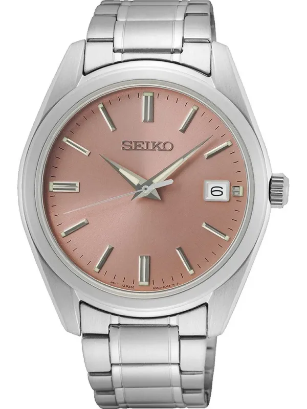 Vue de face de la montre avec boîtier et bracelet argentés, cadran rose poudré, sur fond blanc
