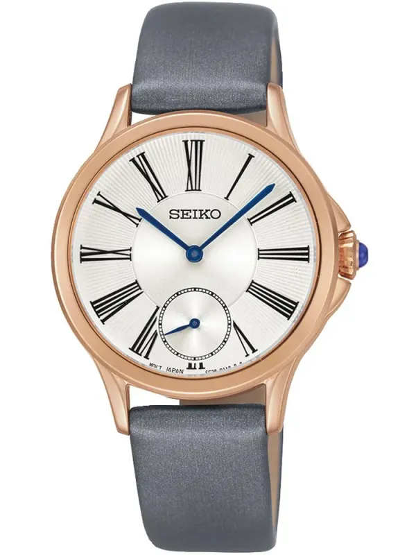 Vista frontal del reloj sobre fondo blanco, encuadre centrado con correa gris y caja oro rosa.