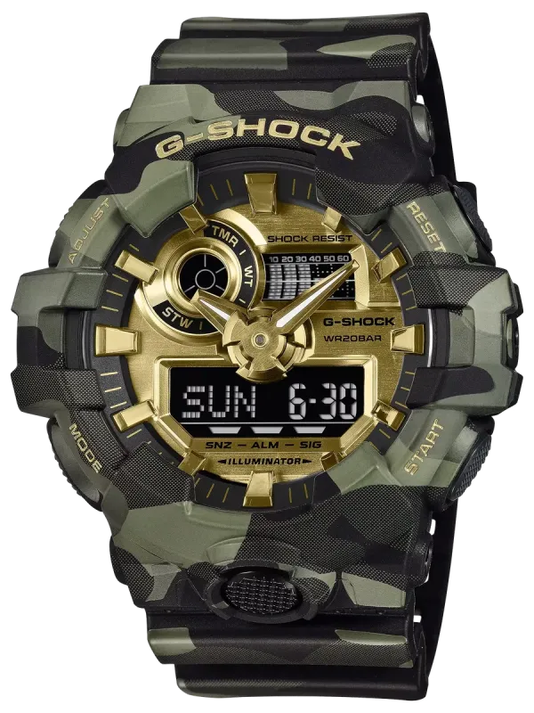 Vista frontal completa del reloj con diseño de camuflaje y detalles dorados sobre fondo blanco.