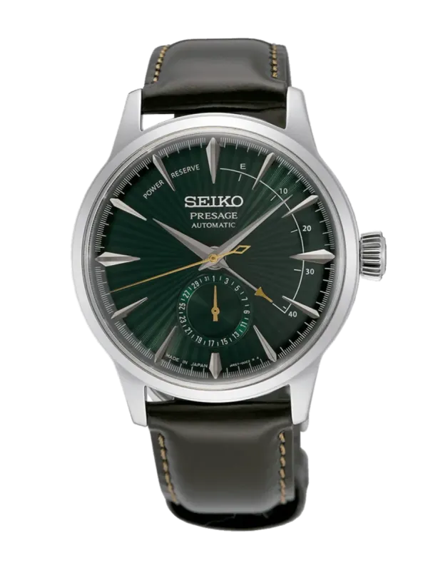 Vue de face complète de la montre avec cadran vert et bracelet en cuir foncé sur fond blanc.
