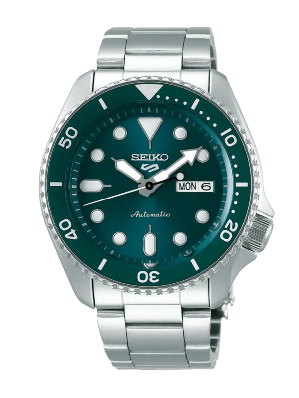 Vista frontal completa del reloj con esfera verde y brazalete de acero, sobre fondo blanco.